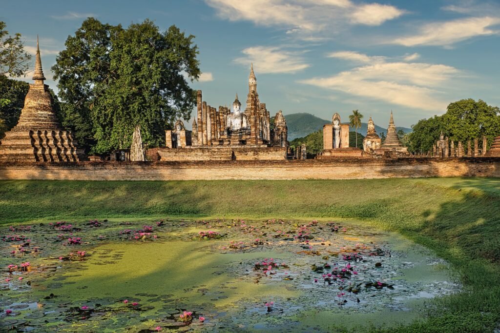 Historic temples reflected in water in Thailand